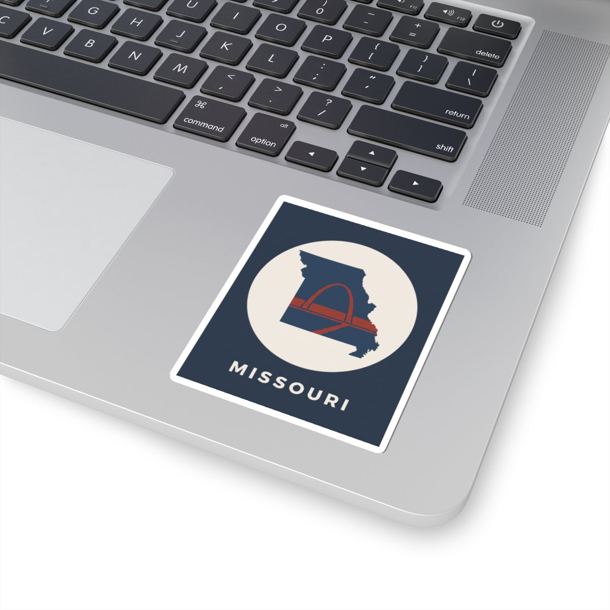 Missouri map sticker with arch design and MISSOURI text, shown on a device surface