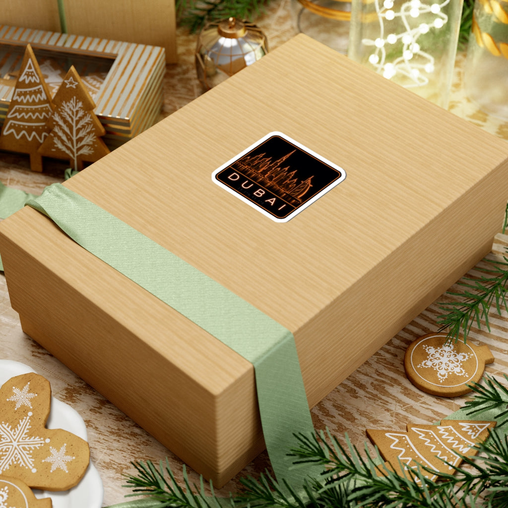 Neon Dubai skyline sticker on gift box, orange city text inside white border