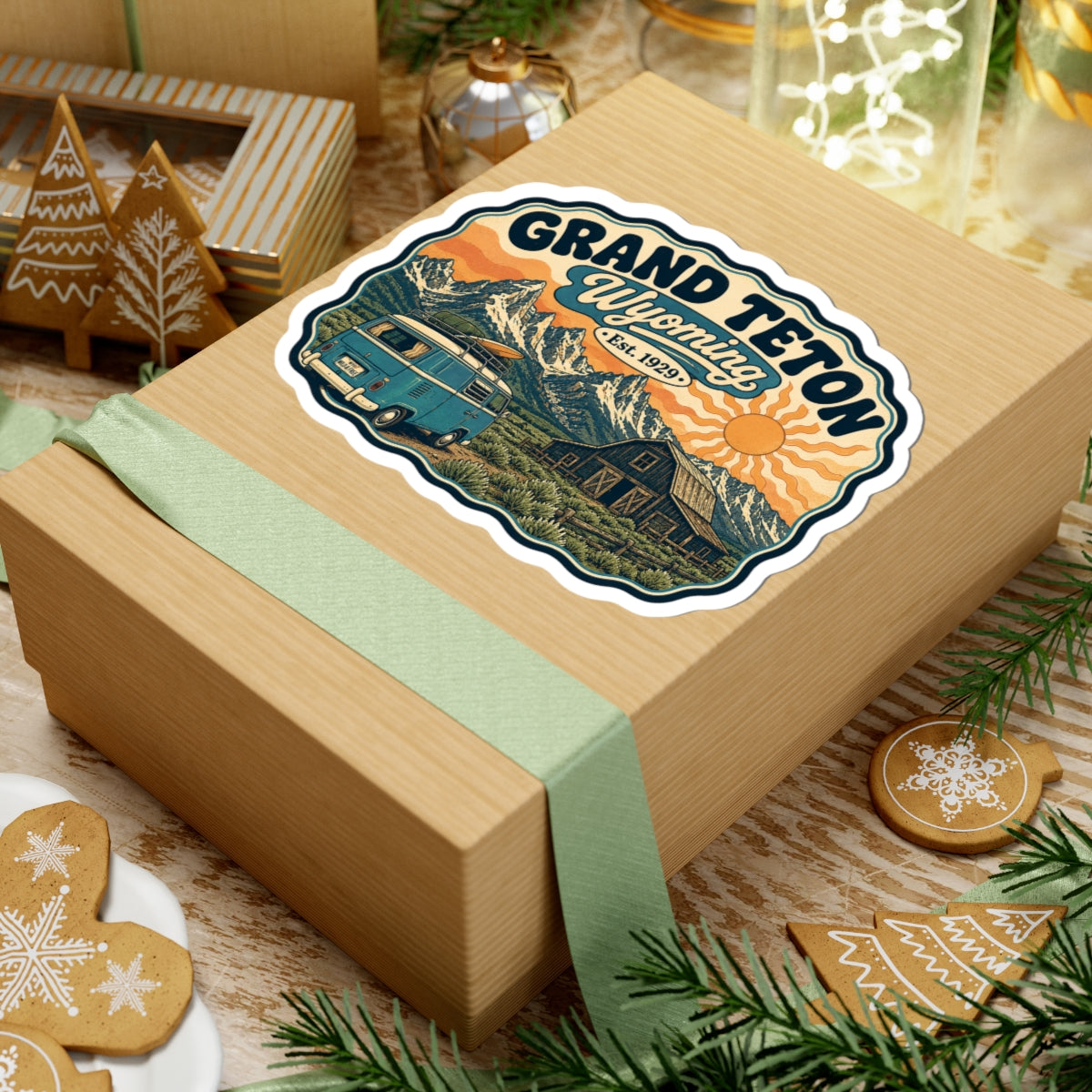 Landscape kiss-cut sticker with Grand Teton Wyoming text, teal camper van, barn, and mountain view