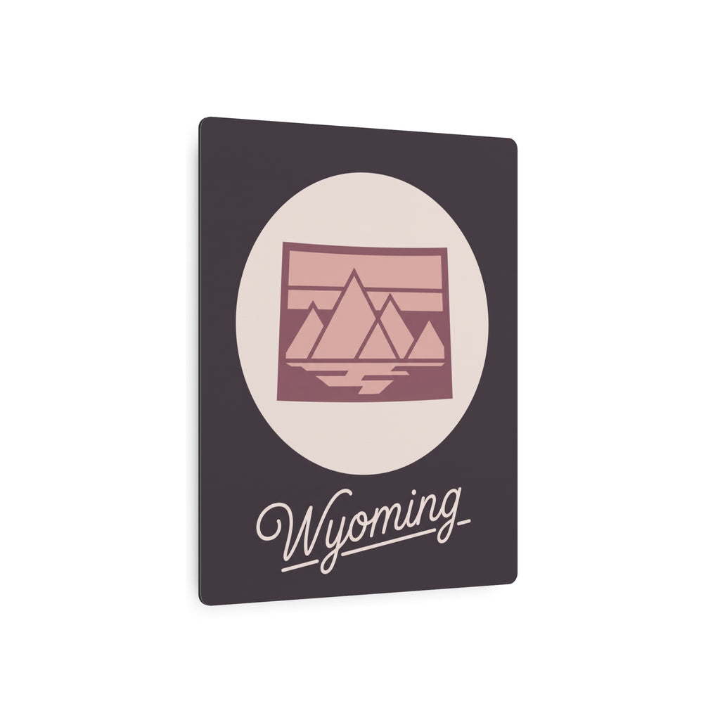Square mauve metal wall art with oval scene emblem and “Wyoming” script at bottom