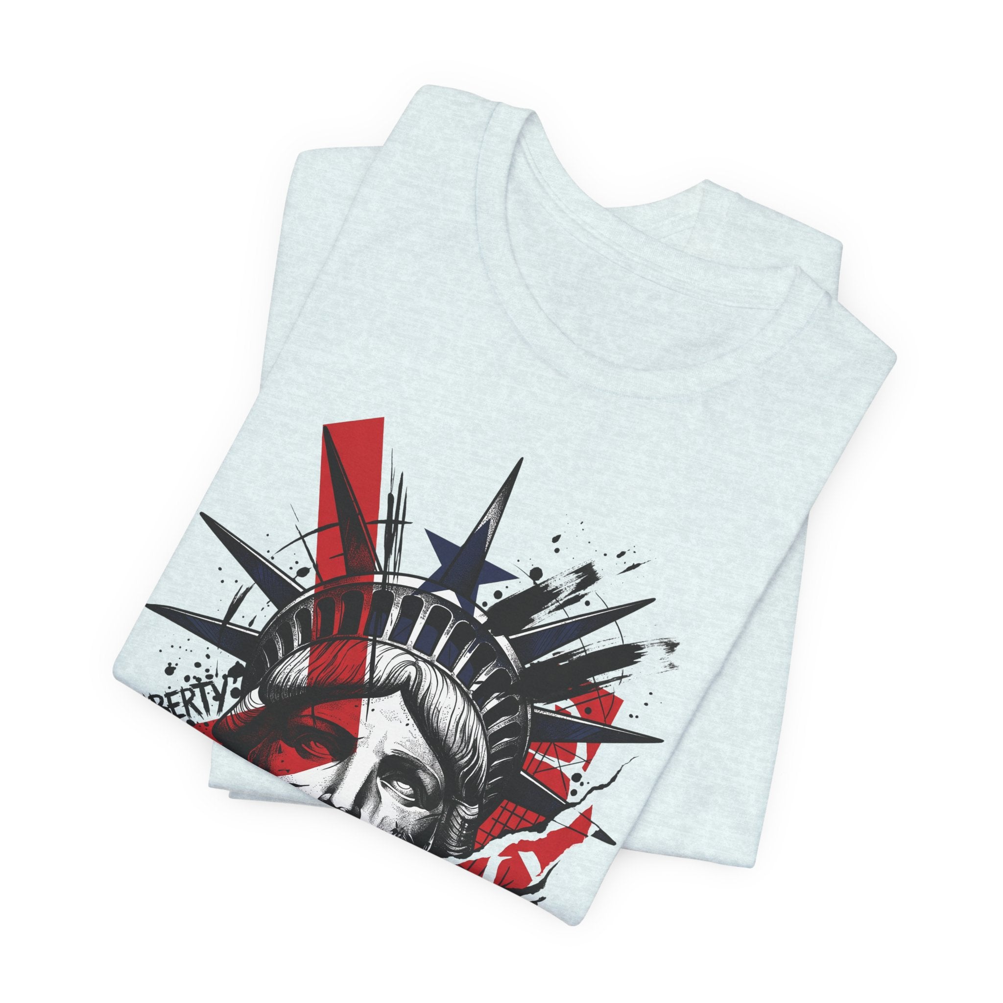 Light blue graphic T-shirt folded, Statue of Liberty face print in red and black