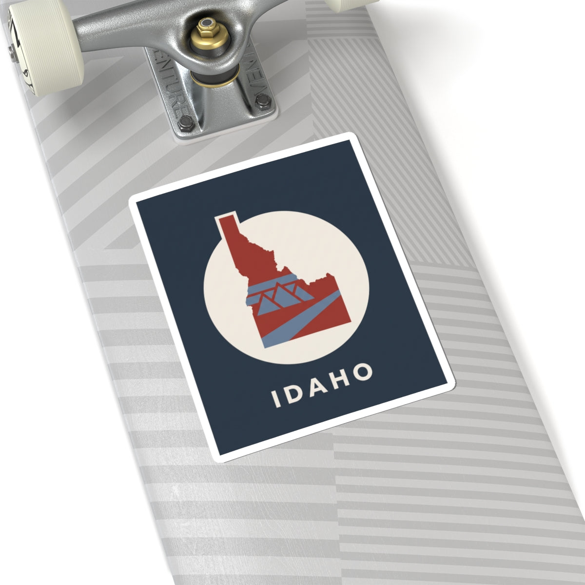 Idaho state silhouette sticker with blue square background, red bridge design, and IDAHO text