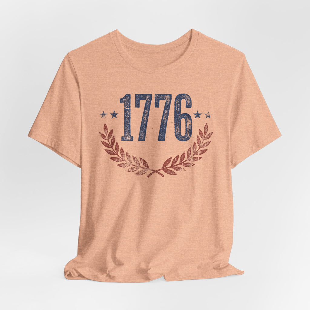 Peach heather T-shirt with centered 1776 graphic and laurel wreath print