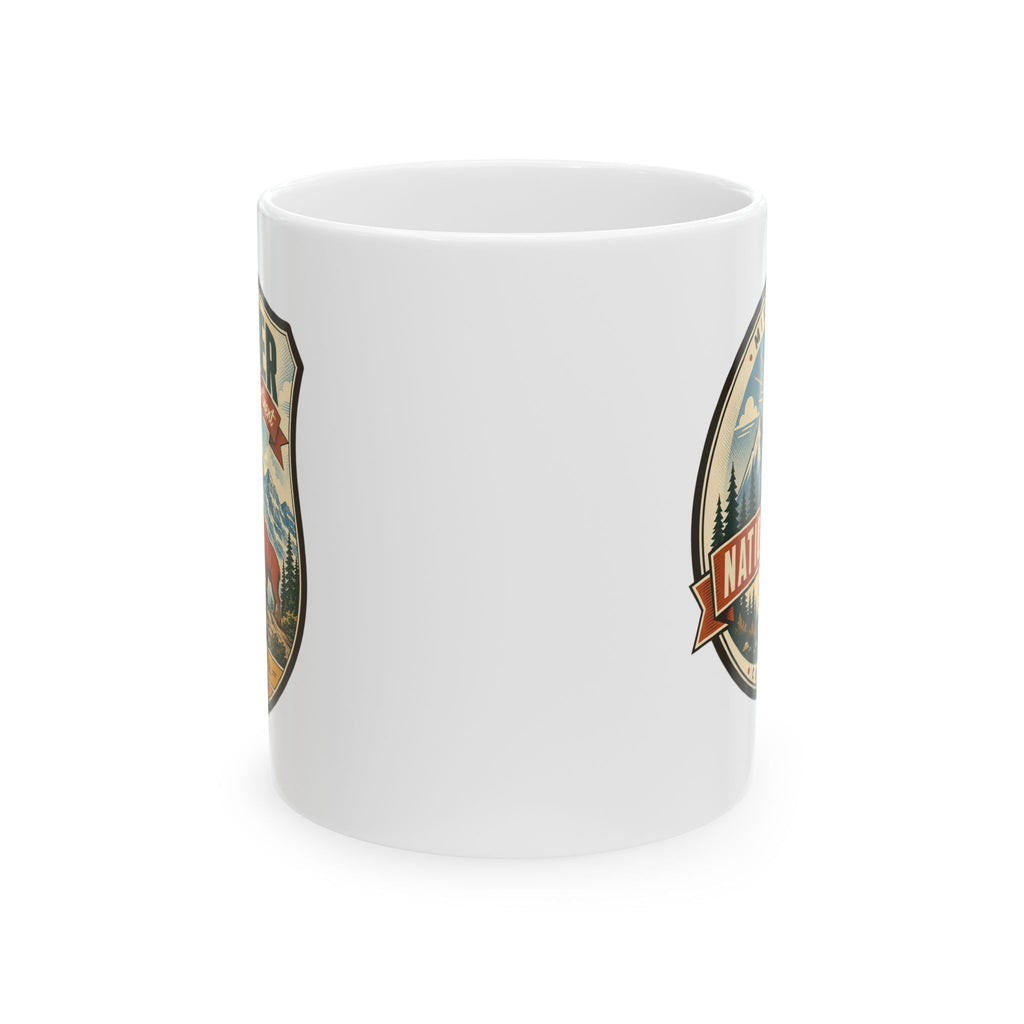 White ceramic mug with partial Glacier badge featuring mountains and bear graphic