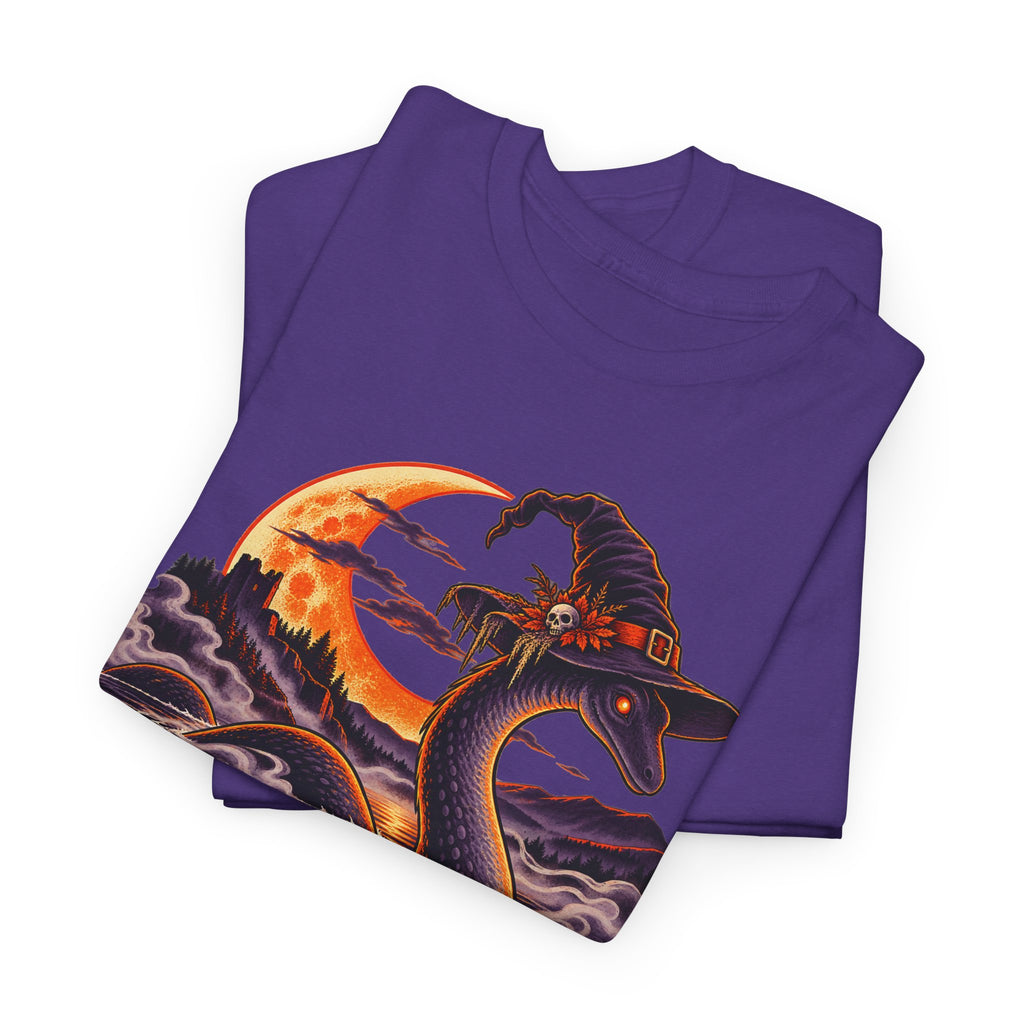 Purple t-shirt with Nessie in witch hat and moonlit lake graphic, folded view