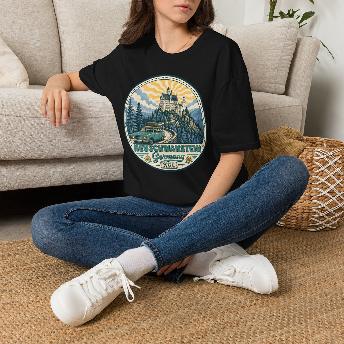 Black crewneck T-shirt with circular illustrated castle graphic on the front