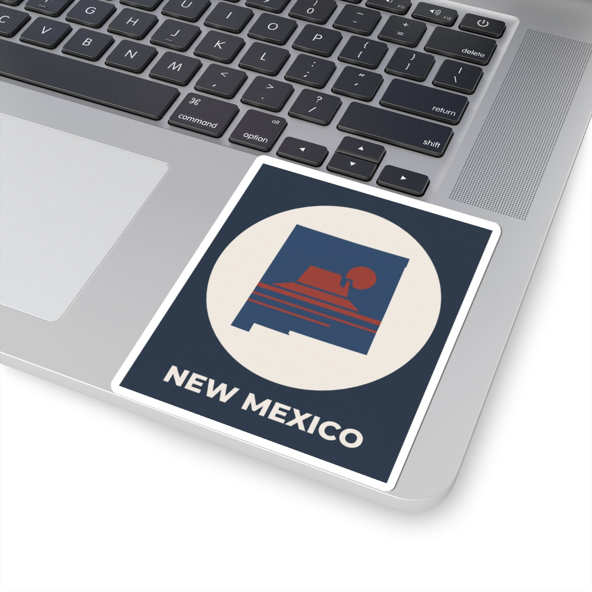 Close-up angled New Mexico sunset kiss-cut sticker with white border and “NEW MEXICO” lettering.