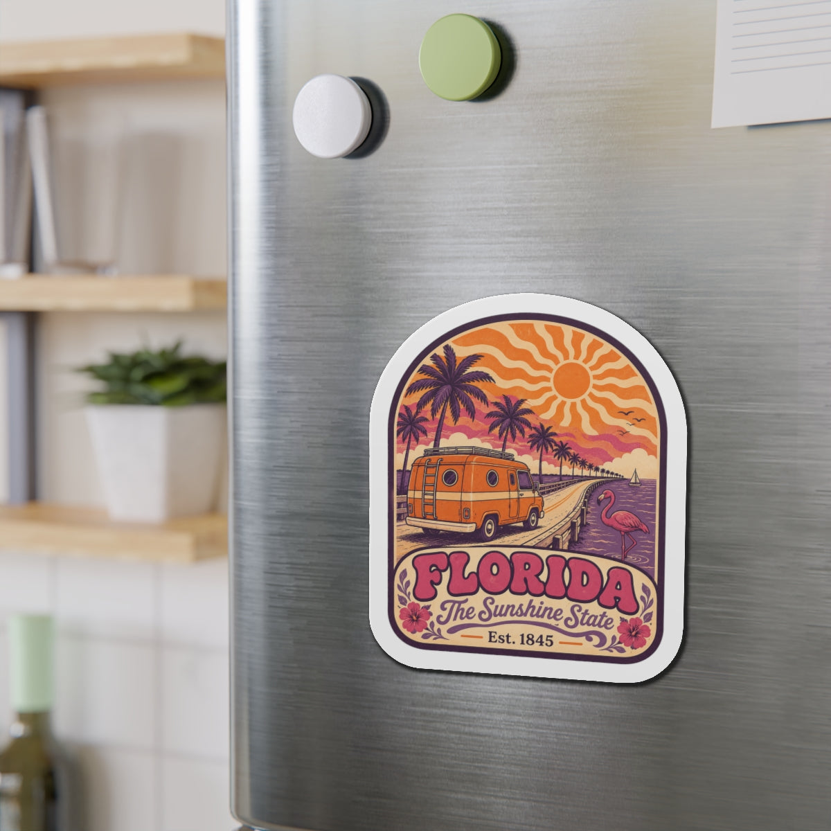 Die-cut Florida magnet with vintage camper van, palm-lined road, and flamingo illustration