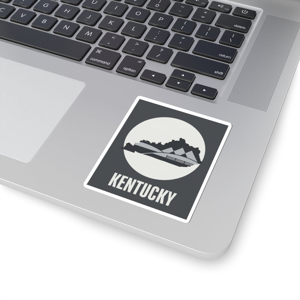 Kentucky vinyl sticker with white border on laptop, dark gray square and KENTUCKY text