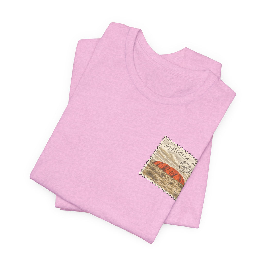 Pink heather travel T-shirt, folded, with small Australia postage-stamp graphic on chest