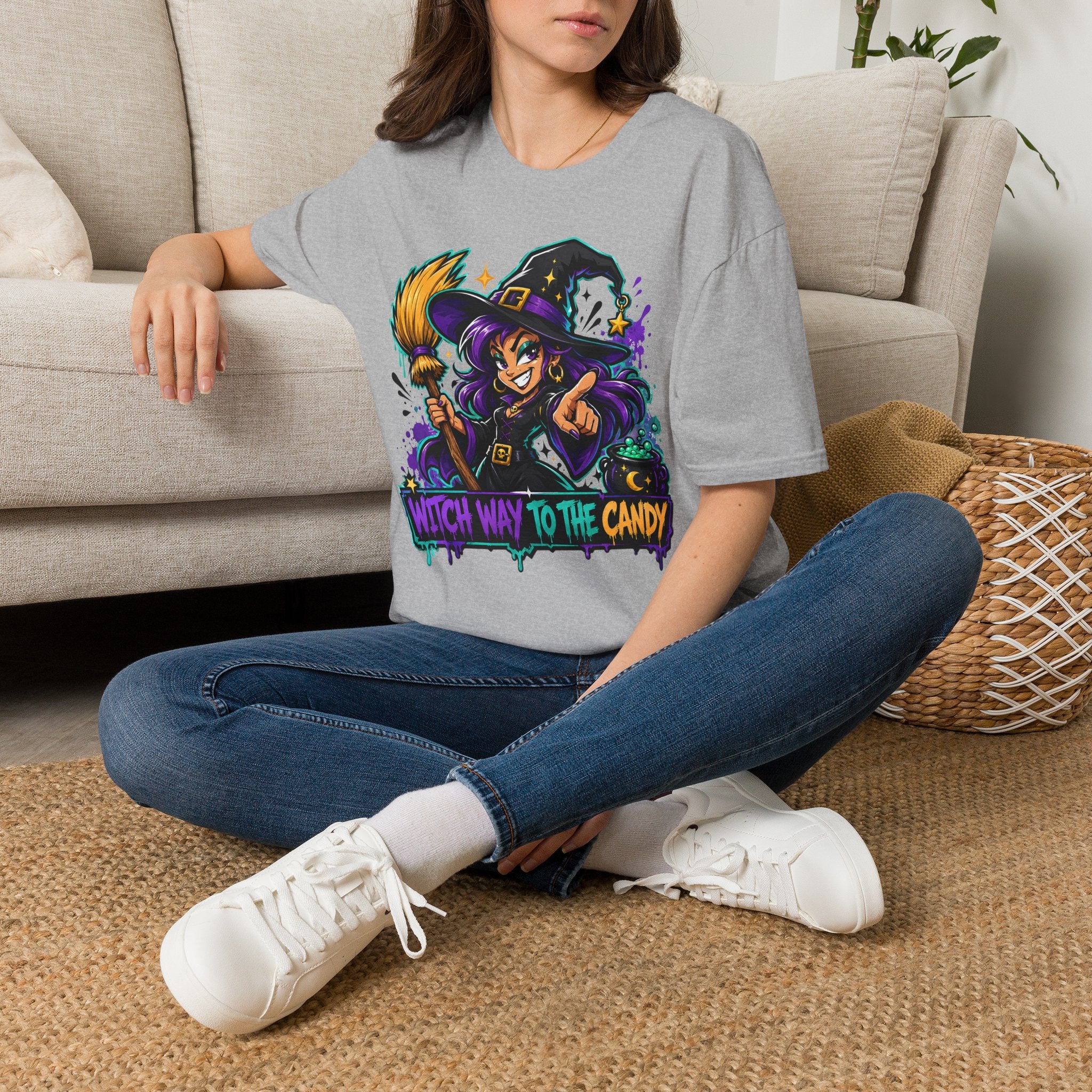 Heather gray T-shirt with colorful witch holding candy, “Witch Way to the Candy” graphic