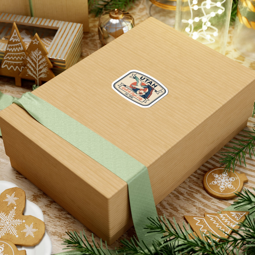 Utah state badge vinyl sticker on gift box, bird and sego lily, white border