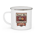 White enamel camping mug with badge graphic, metal rim, and side handle.