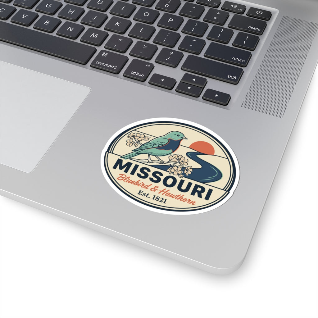 Round Missouri state badge sticker featuring a teal bluebird, flowers, and “Est. 1821”