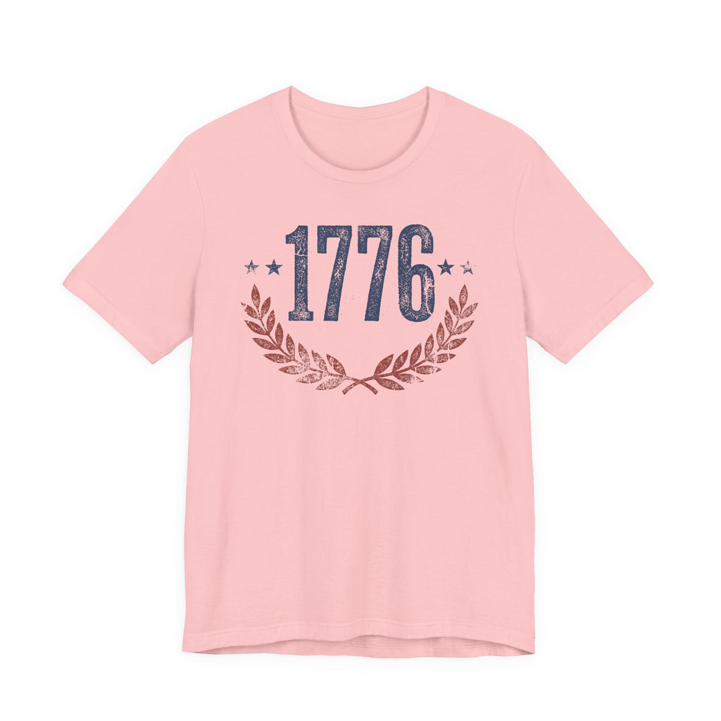 Pink T-shirt with “1776” graphic and laurel wreath design at the chest