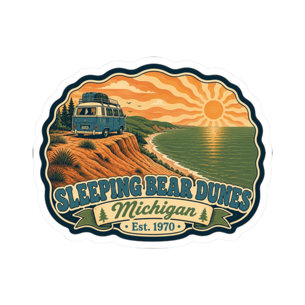 Die-cut sticker with camper van on dunes, shoreline trail, sunrise sky, and “Sleeping Bear Dunes” title