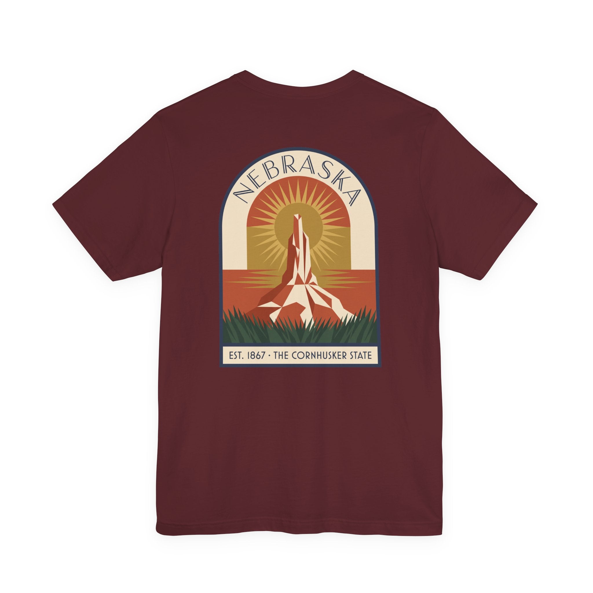 Burgundy Nebraska graphic T-shirt with art deco tower and sunset badge