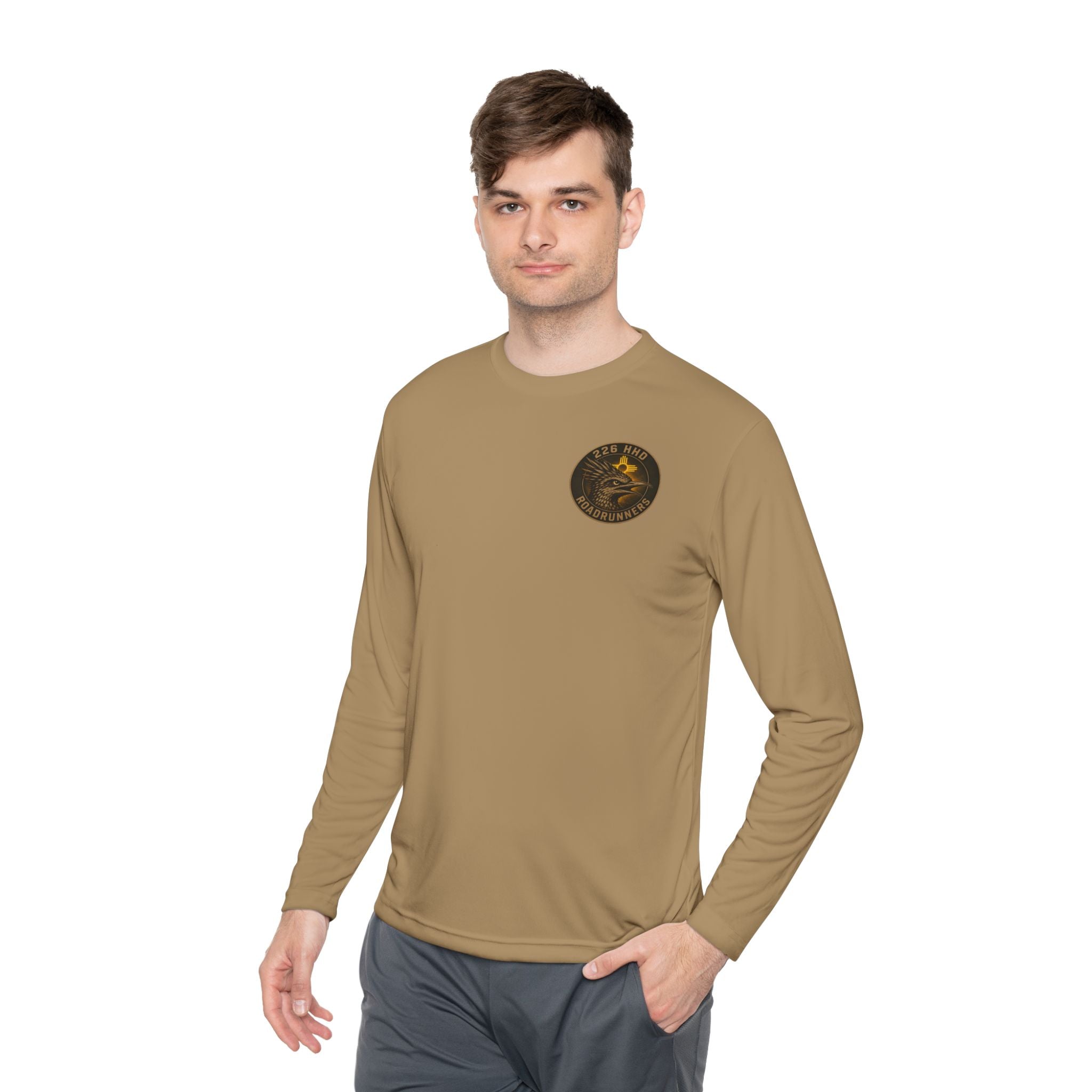 Coyote brown long-sleeve polyester tee with small chest emblem, worn