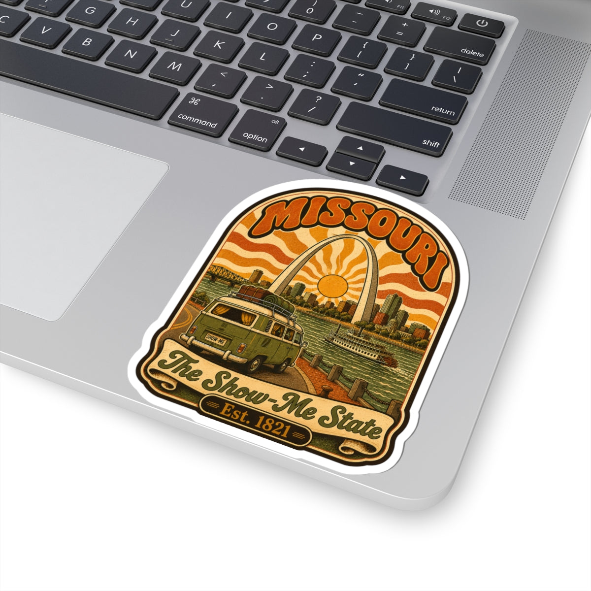 Missouri retro roadtrip sticker on laptop keyboard, “The Show-Me State” under arch