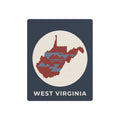 West Virginia metal map art sign, dark blue with circular WV graphic and 'WEST VIRGINIA' text.