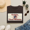 Dark brown T-shirt with retro turkey graphic and bold “Gobble, Then Wobble” text