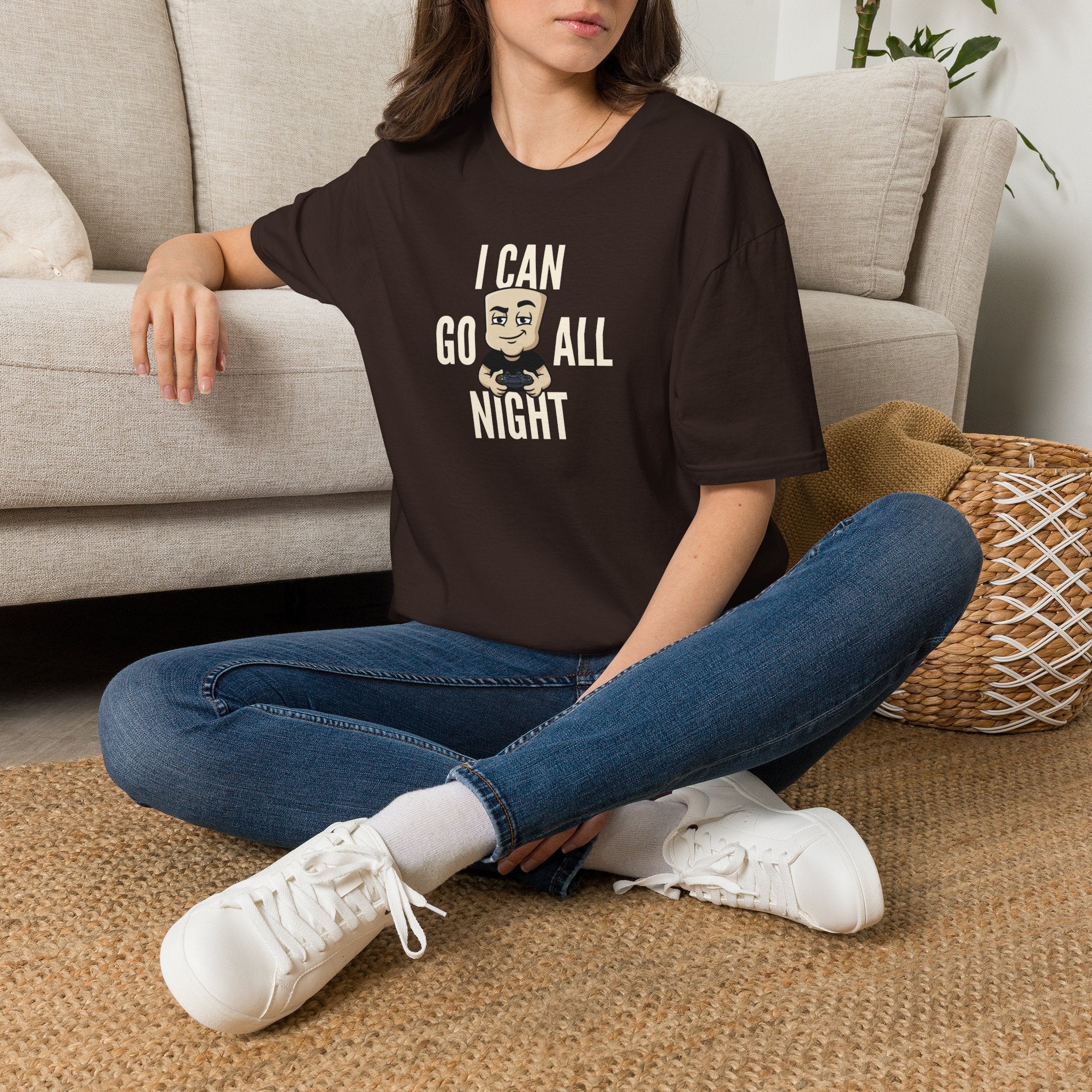 Dark brown graphic T-shirt with "I CAN GO ALL NIGHT" gamer controller print.
