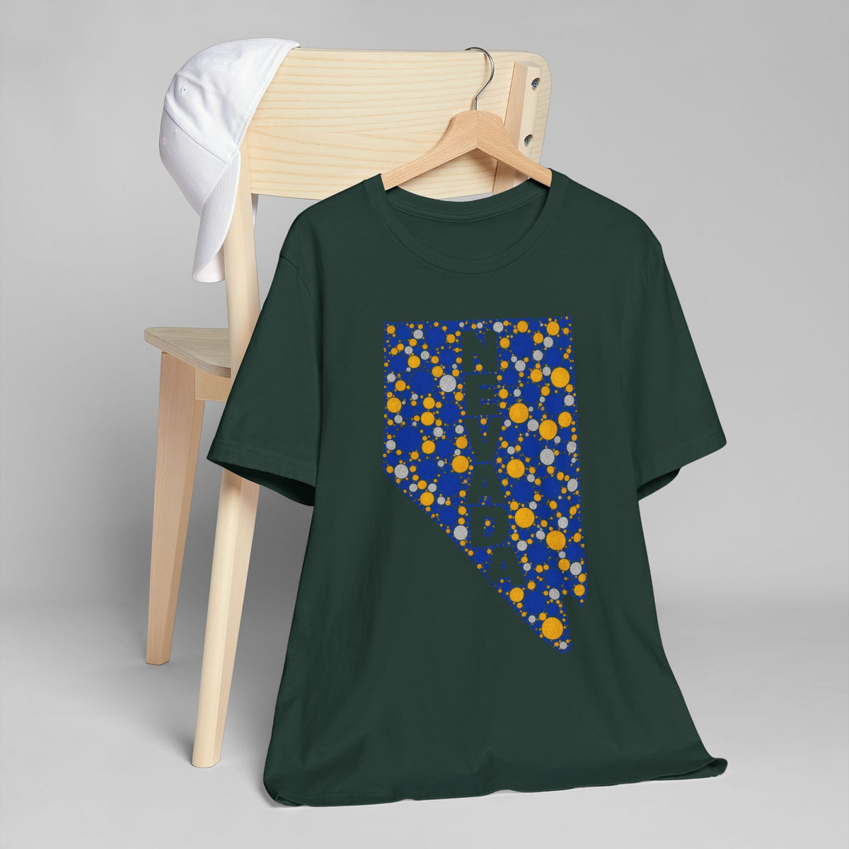Forest green crewneck T-shirt with Nevada state floral dot graphic in blue and gold
