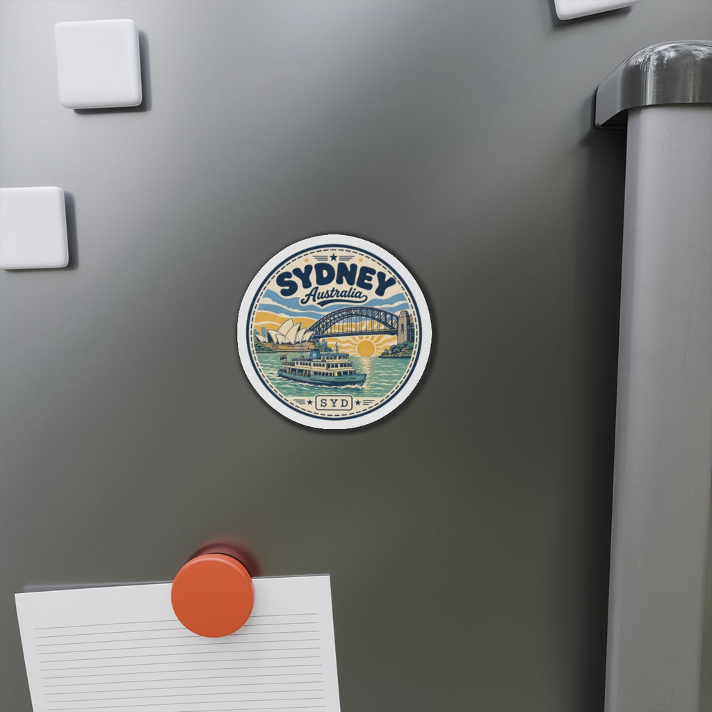 Round Sydney Harbour magnet attached to refrigerator door with SYD and Australia text