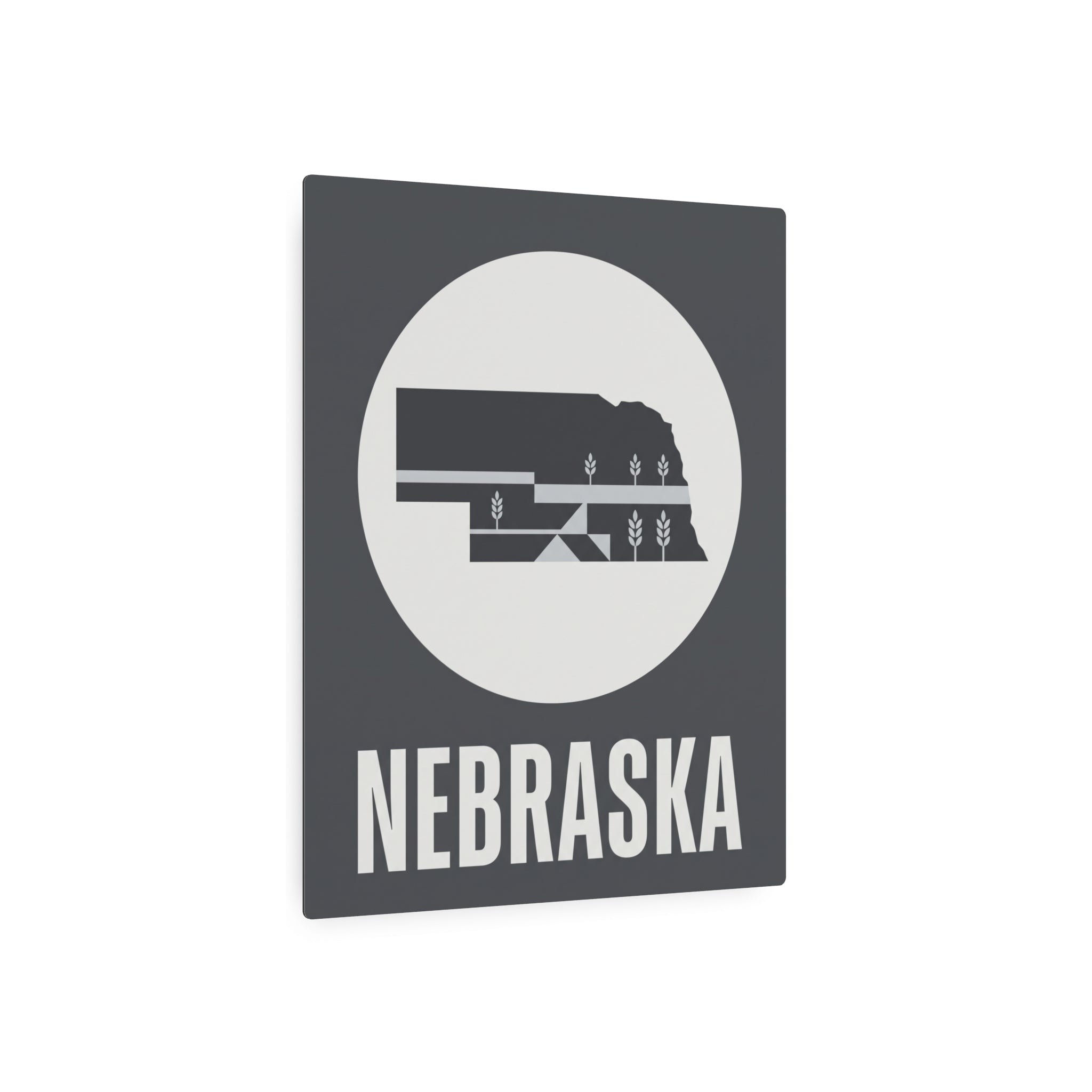 Nebraska metal art sign with dark square frame, circular wheat graphic, and bold NEBRASKA