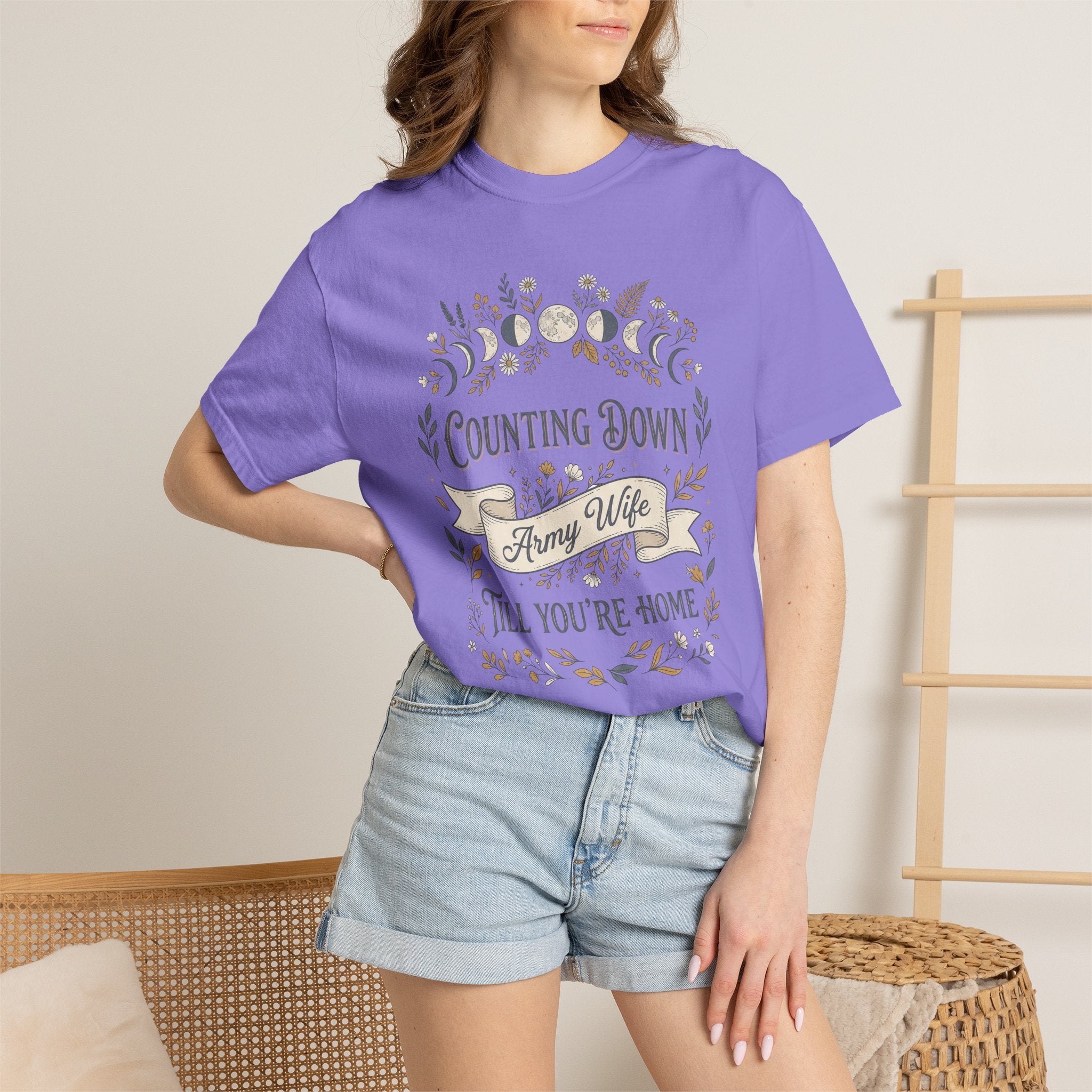 Purple T-shirt worn by model with floral “Counting Down,” “Army Wife,” and “Till You’re Home”