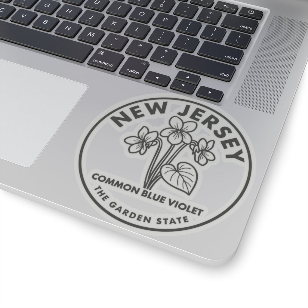 Transparent vinyl decal showing New Jersey common blue violet on a laptop lid
