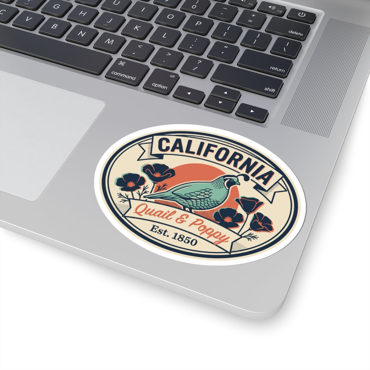 California oval quail and poppy sticker centered on a laptop touch area