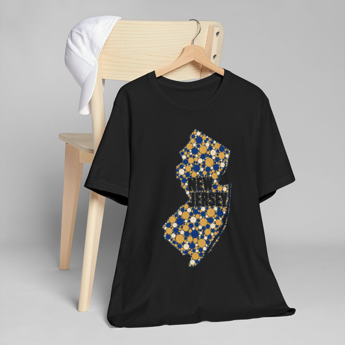 Black t-shirt with colorful floral New Jersey outline graphic on the front