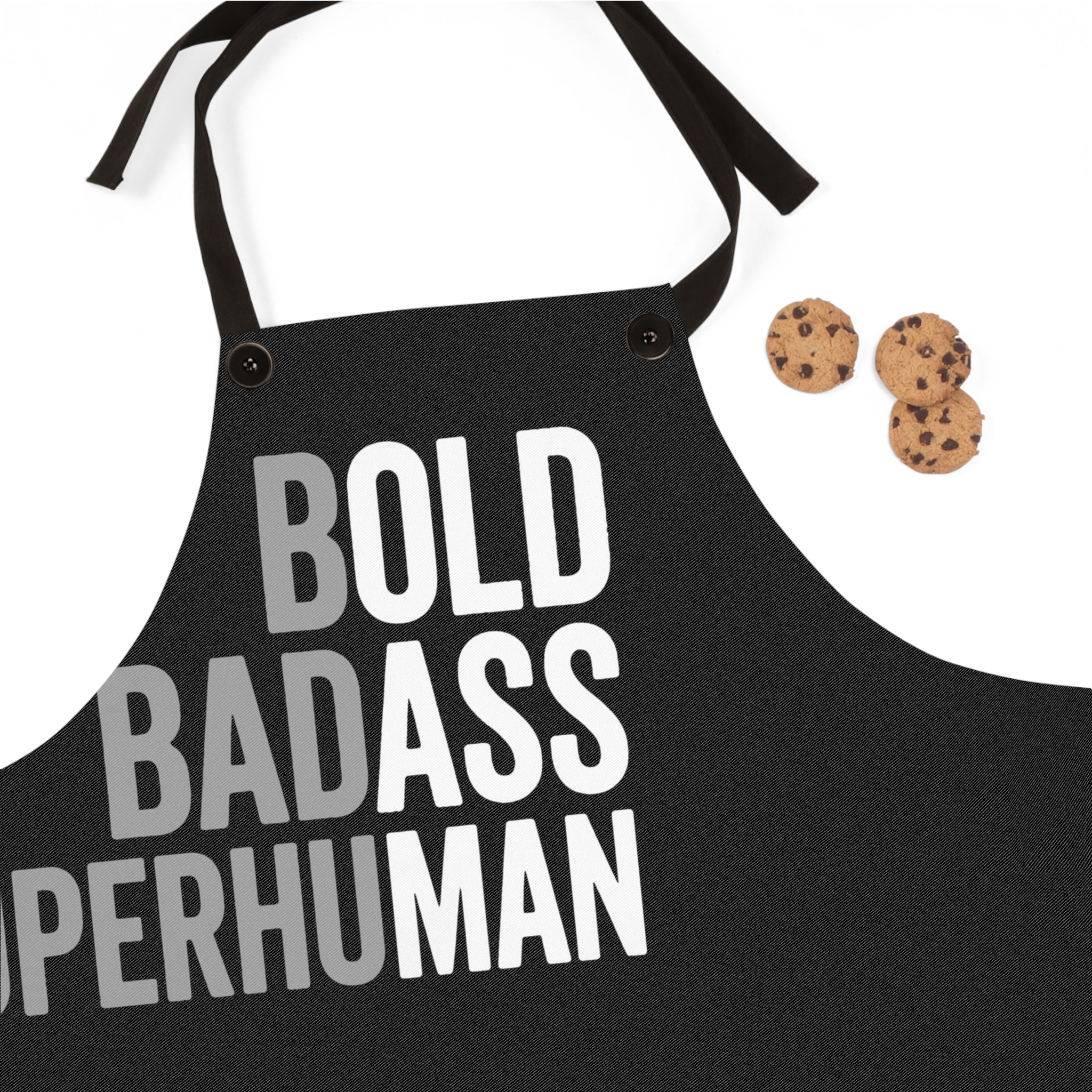 Black apron front with large 'BOLD BADASS SUPERHUMAN' lettering and side ties