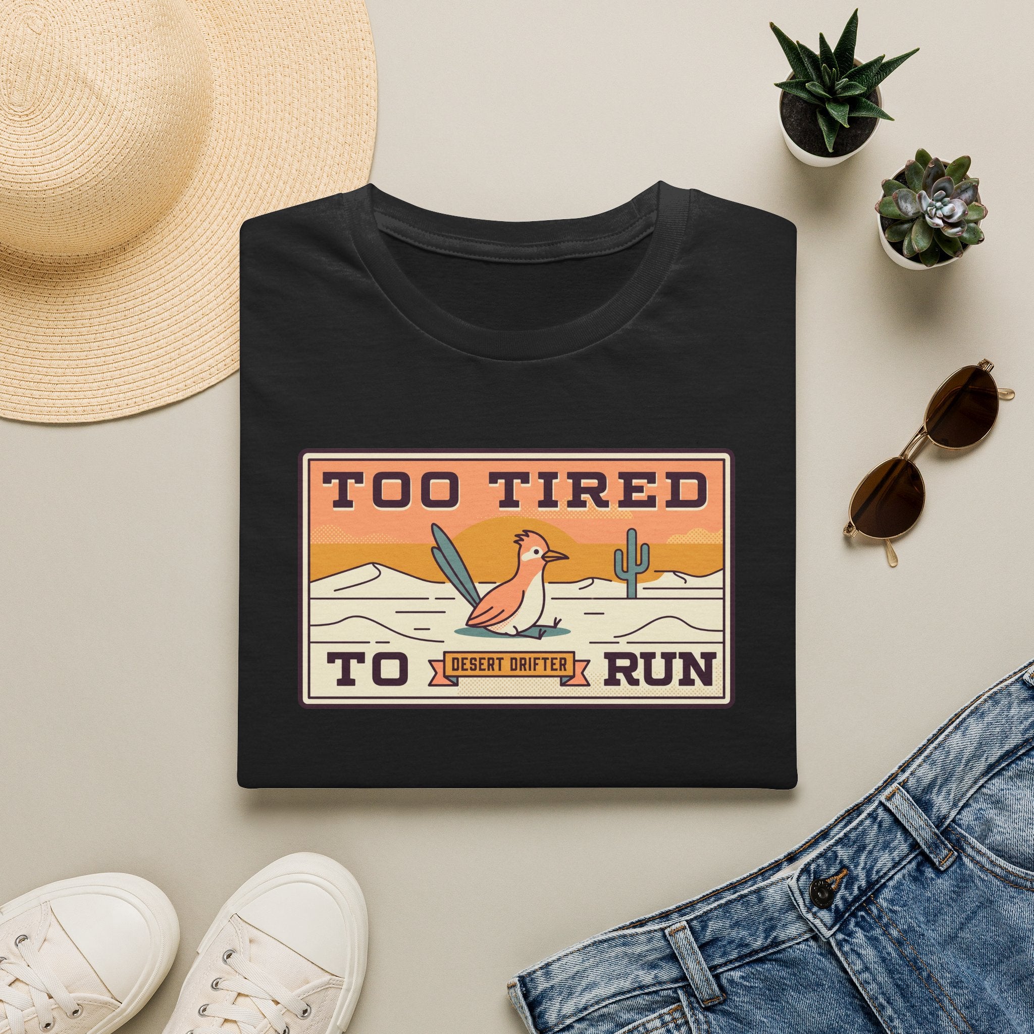Black crew-neck T-shirt with Too Tired To Run desert roadrunner graphic