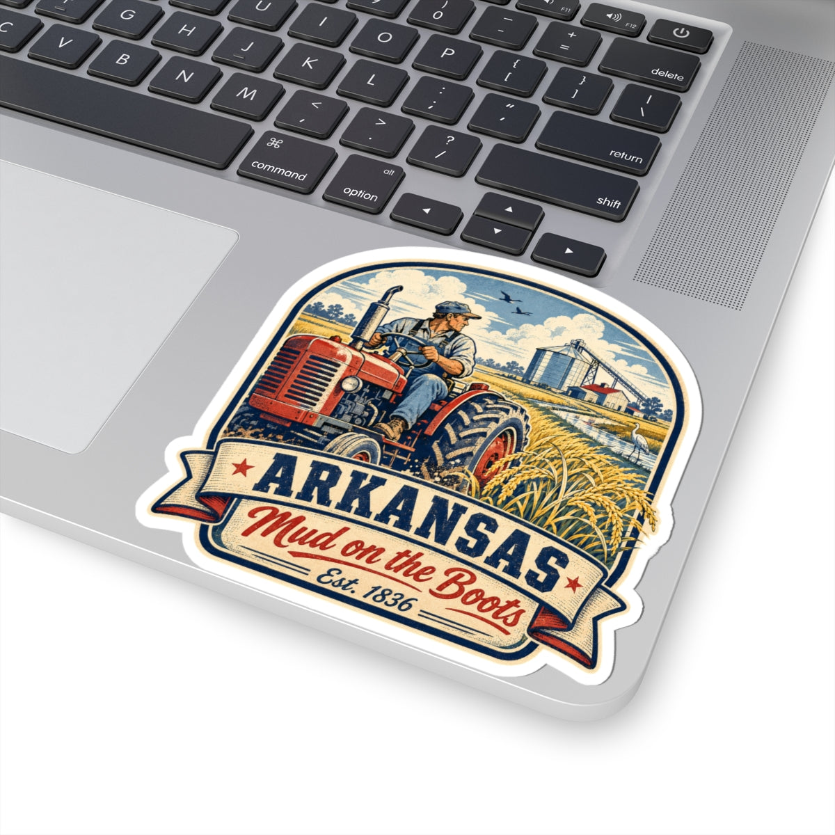 Kiss-cut sticker with tractor, wheat field, and Arkansas “Mud on the Boots” badge