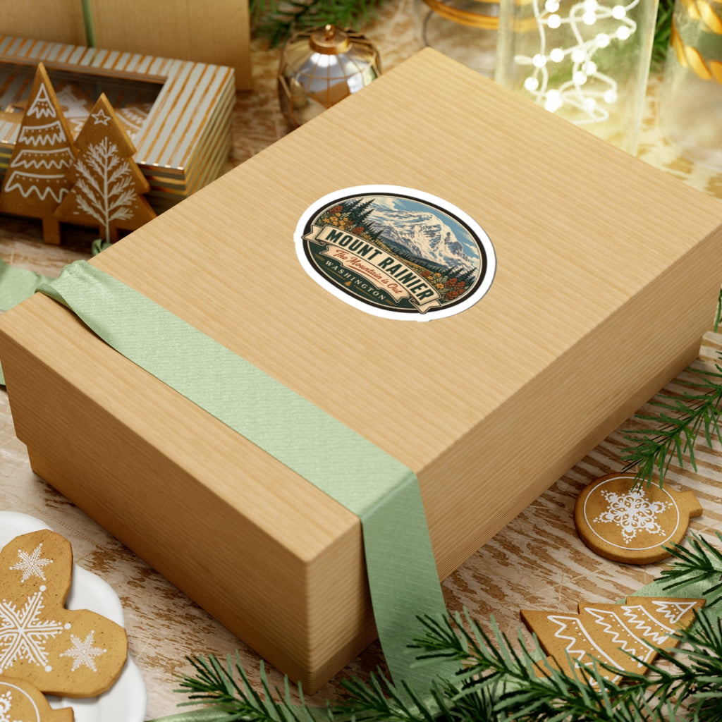 Oval Mount Rainier sticker on gift box lid, showing mountain artwork and WASHINGTON text