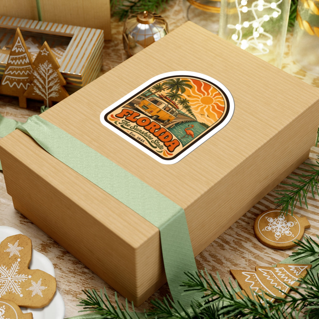 Florida surf bus sticker on a gift box, with palm trees and a flamingo by the road