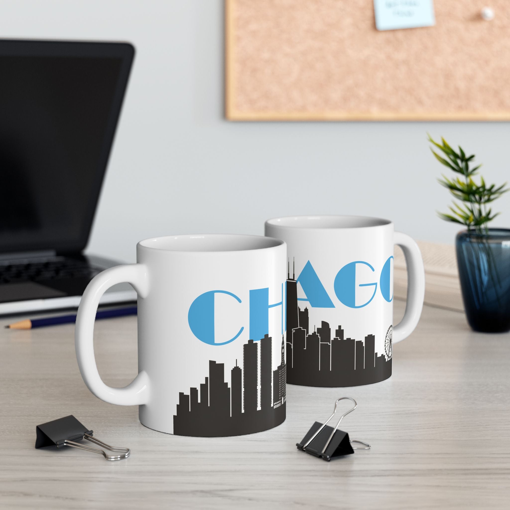 Set of two white ceramic mugs with black Chicago skyline and blue 'CHAGO' print