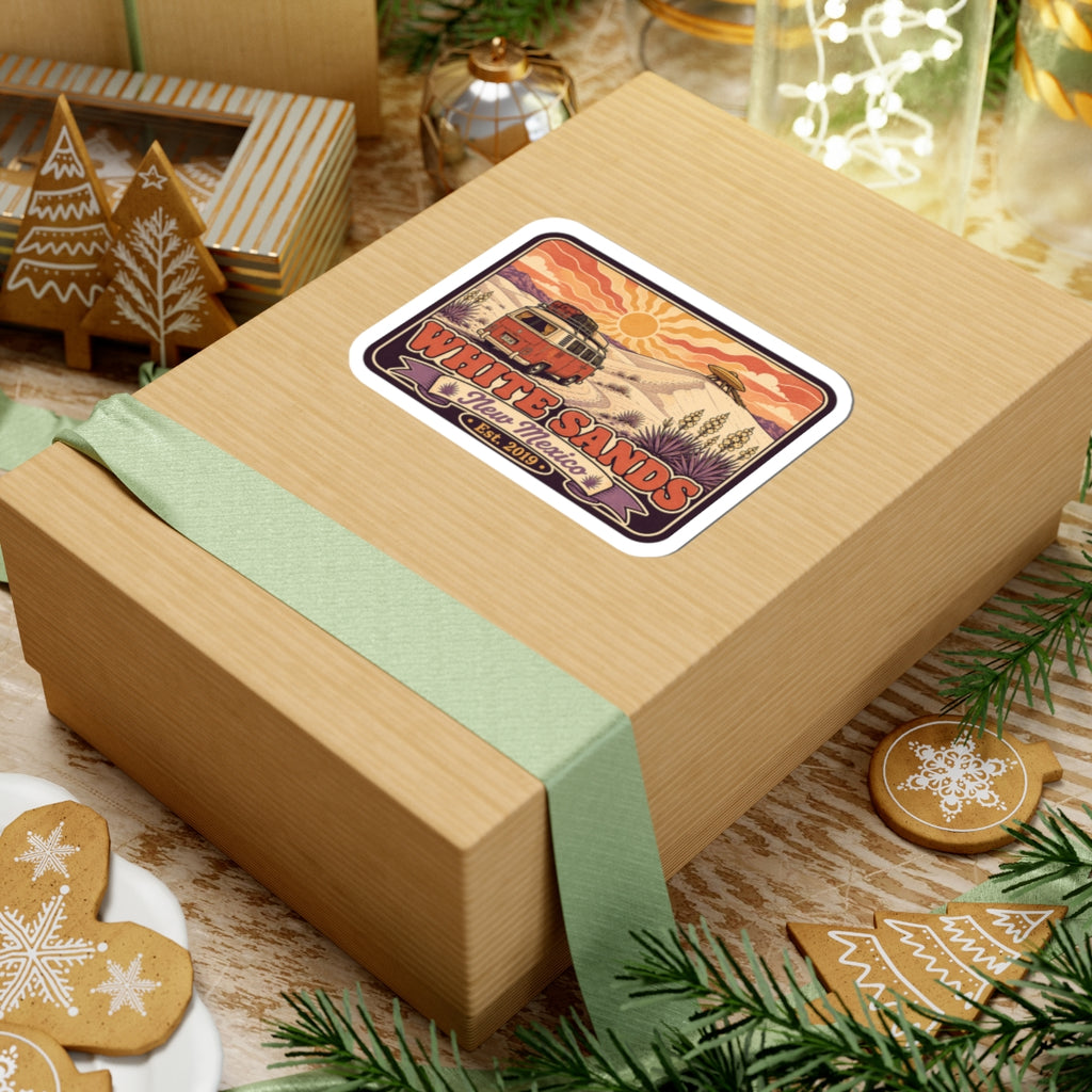 Vinyl sticker on gift box with desert sun, cacti, and White Sands lettering