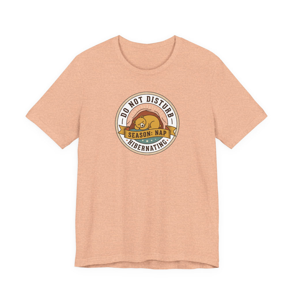 Light peach T-shirt with hibernating bear "Do Not Disturb" circular graphic on chest