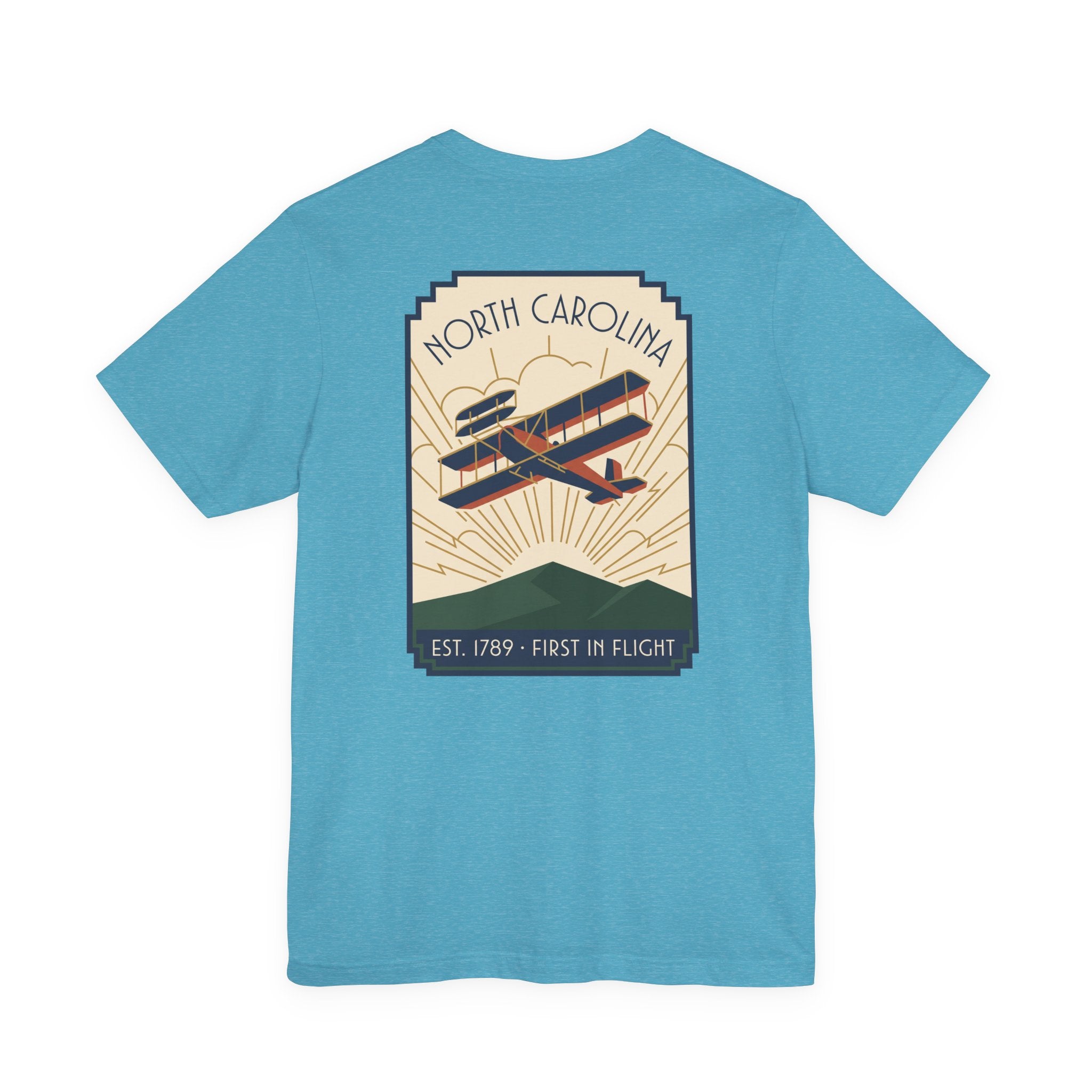 Light blue T-shirt with large North Carolina biplane graphic on the back