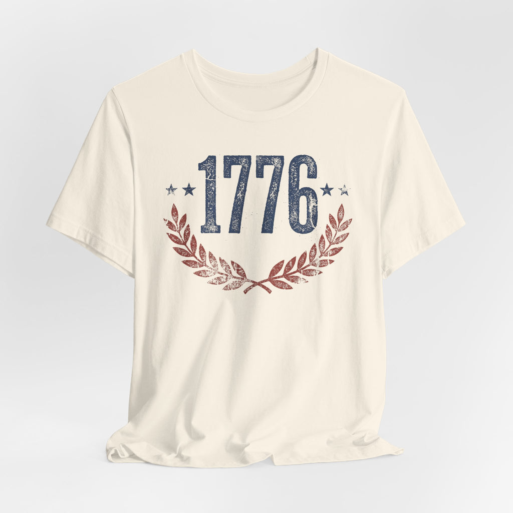Cream T-shirt with centered “1776” graphic and laurel wreath design