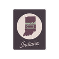 Indiana metal wall art: plum state in cream circle with 'Indiana' script