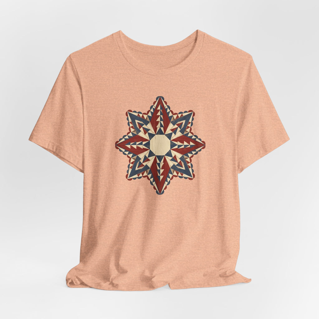 Peach short-sleeve crew-neck tee with colorful southwestern compass star mandala graphic.