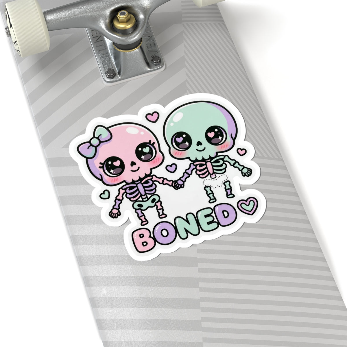 Pastel skeleton couple kiss-cut sticker with hearts and bold 'BONED' typography