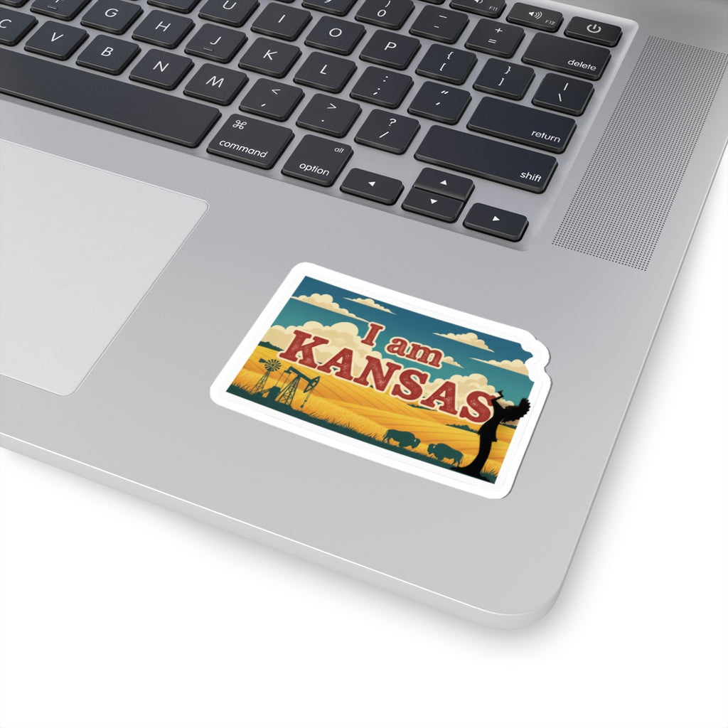 I am Kansas sticker on a laptop keyboard, white border around the Kansas graphic