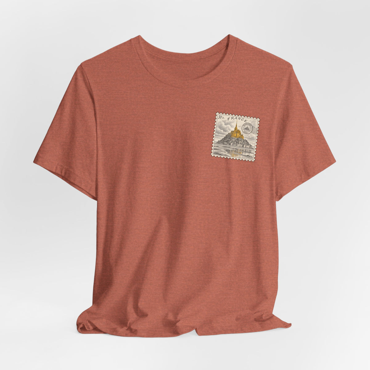 Rust brown crew-neck T-shirt with small postage stamp graphic on chest