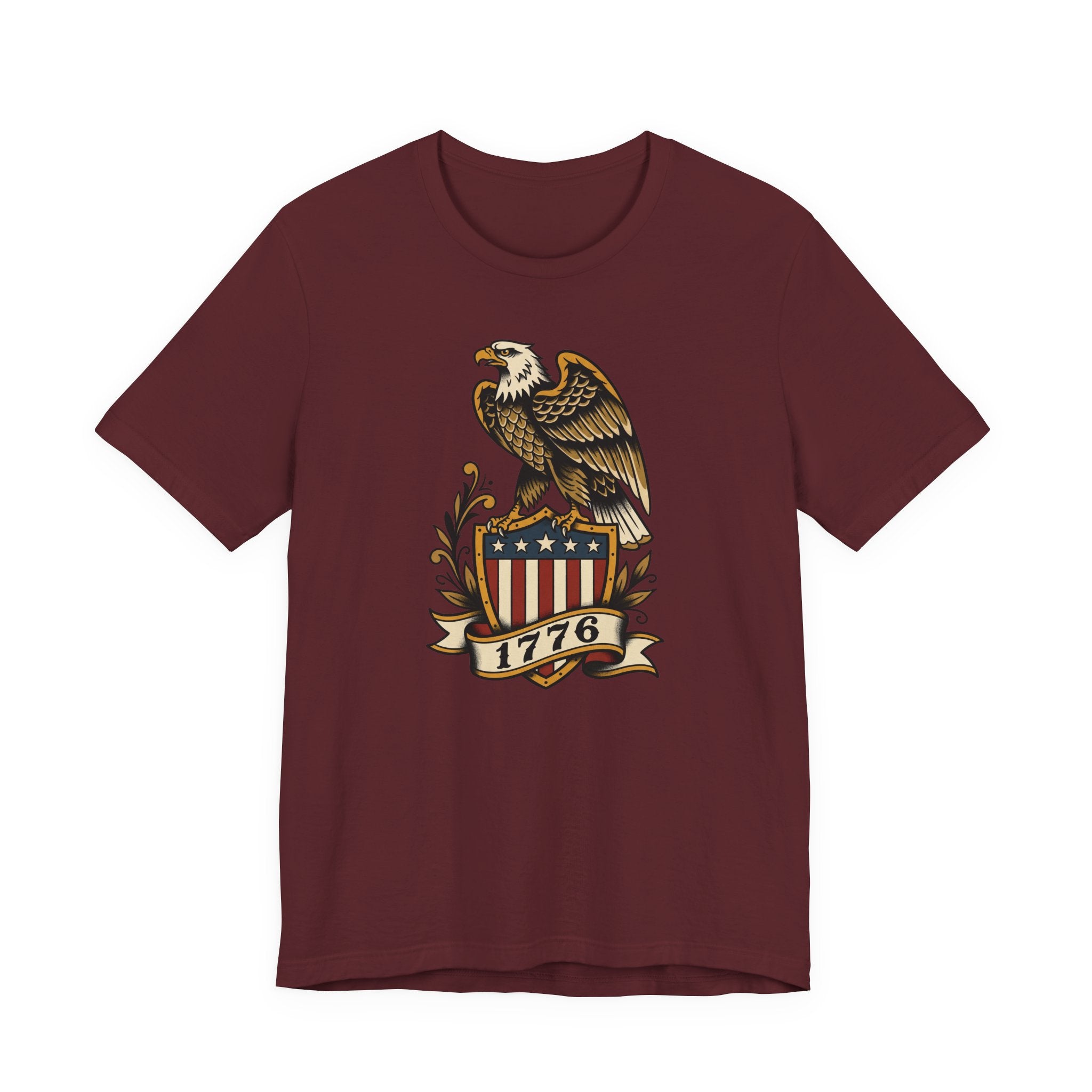 Graphic T-shirt, maroon, front features gold eagle and 1776 shield logo.