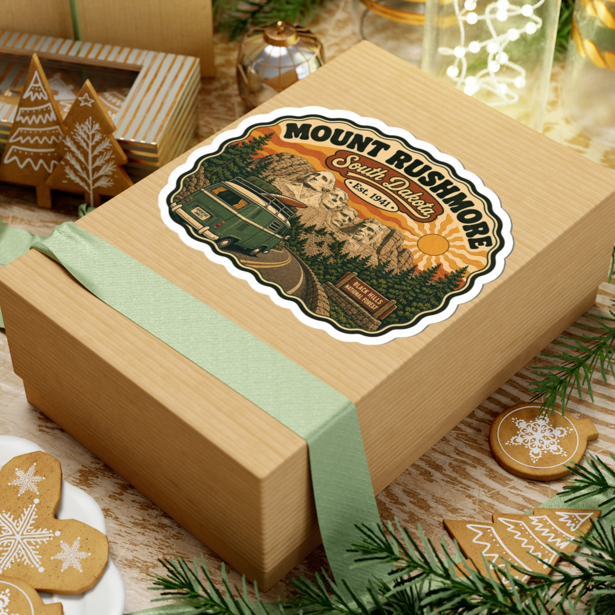 Die-cut sticker on gift box top, Mount Rushmore South Dakota design with green camper